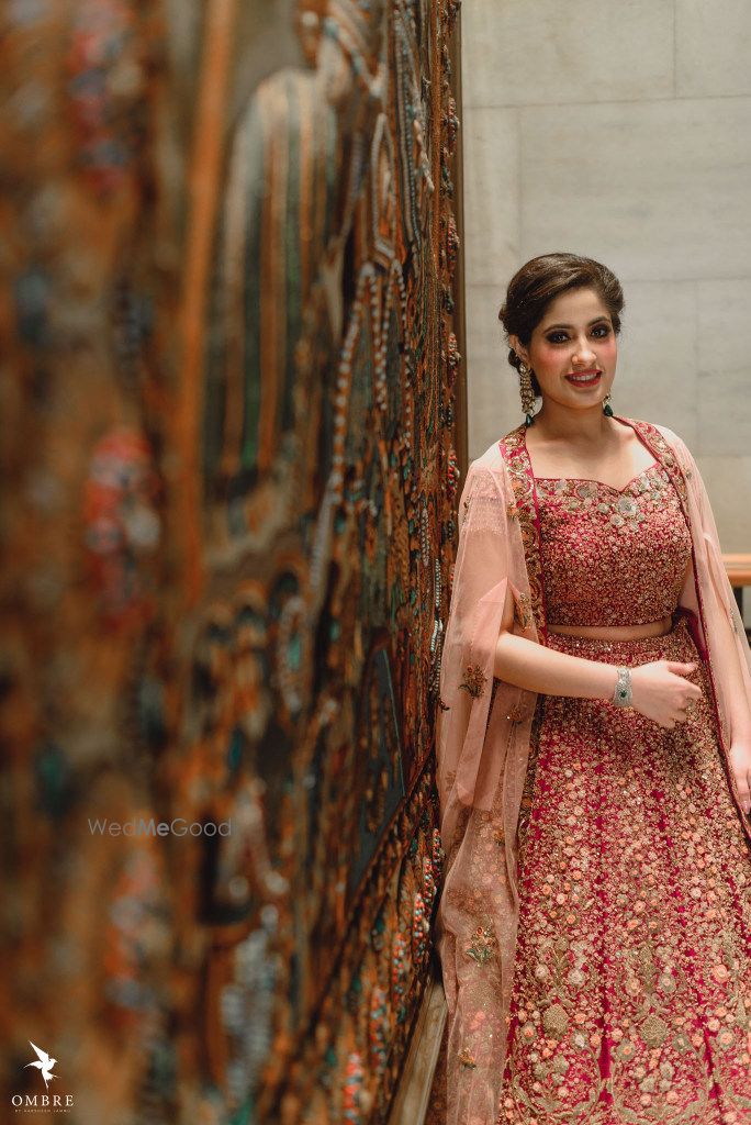 Photo of A bride to be in a shimmer lehenga for her engagement ceremony