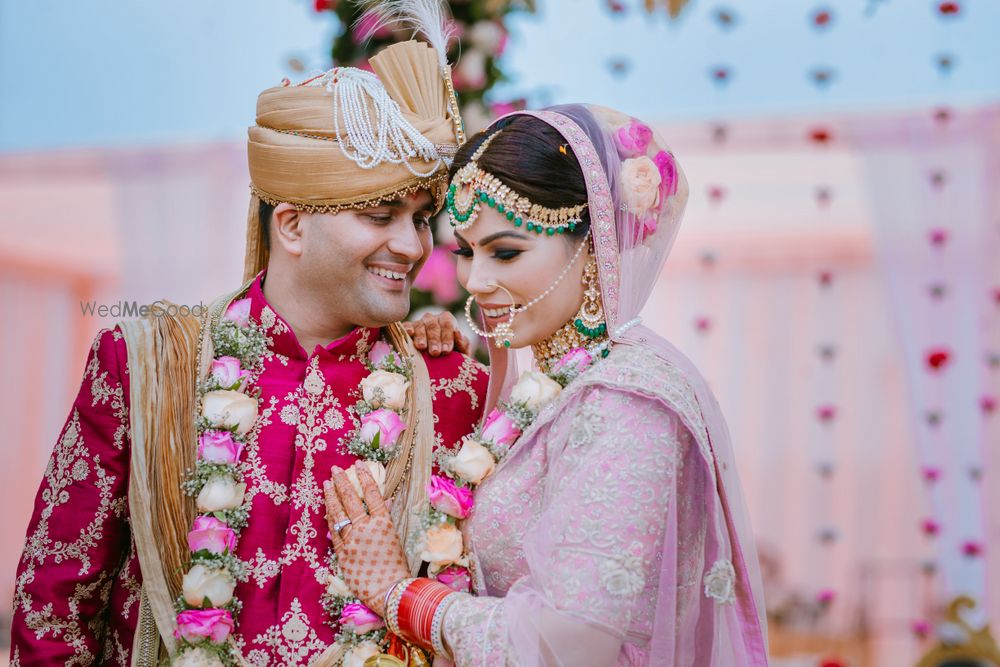 Photo of A happy and bright couple shot on the wedding.