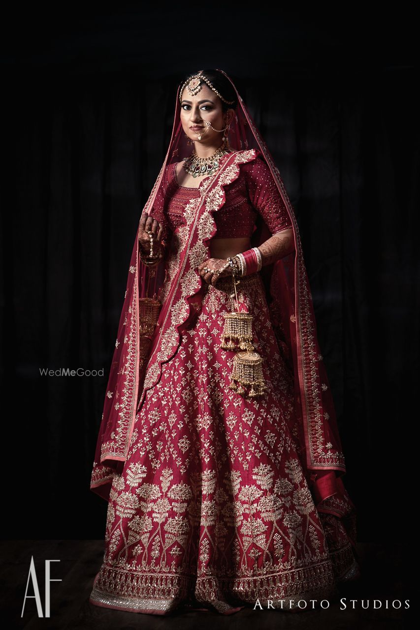 Photo of Royal bridal lehenga in maroon with scalloped edge