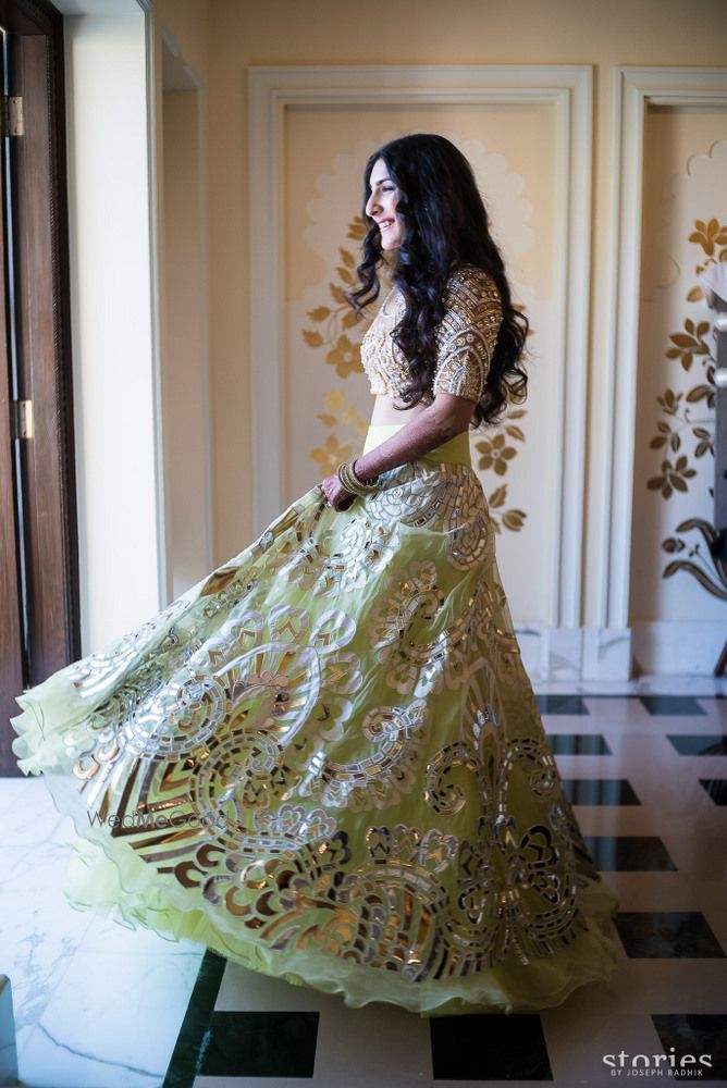 Photo of Lime green and gold mirror work lehenga by Abu Jani