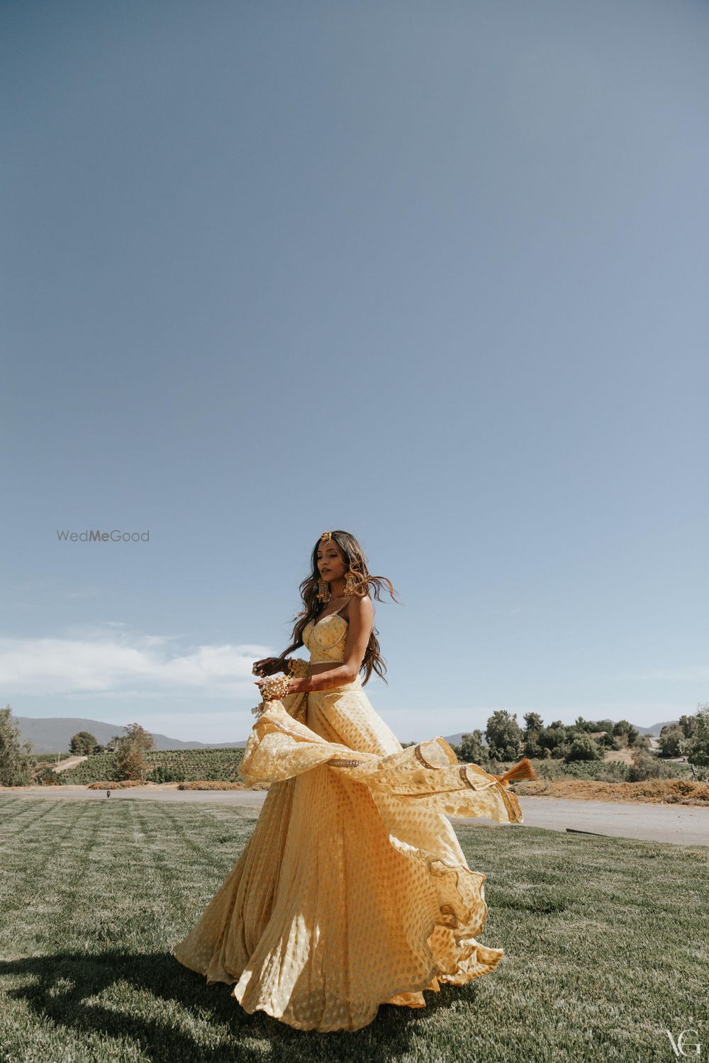 Photo of pretty haldi bridal portrait in a yellow outfit