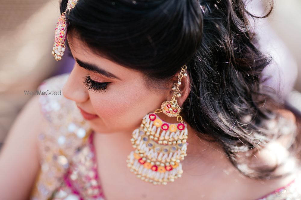 Photo of Fun mehendi jewellery with unique earrings