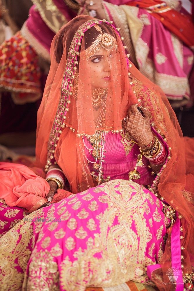 Photo of Pink and orange bridal lehenga