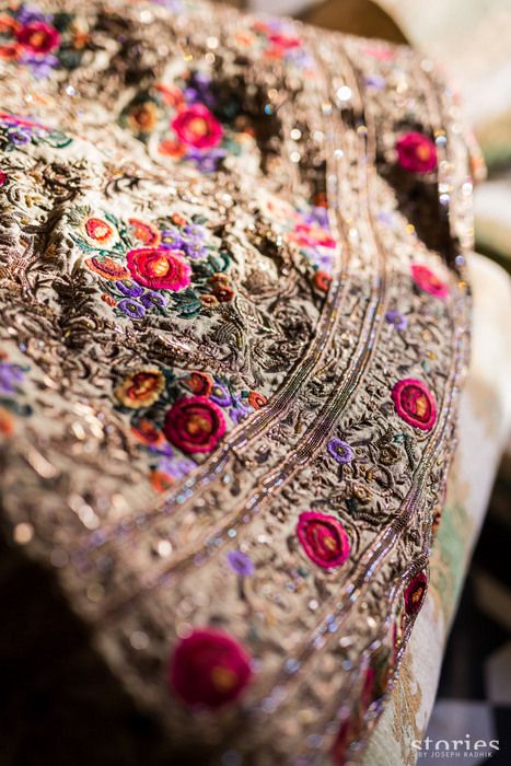 Photo of royal gold bridal lehenga with threadwork and zardozi