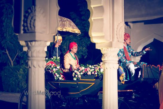 Photo of groom entry in vintage car