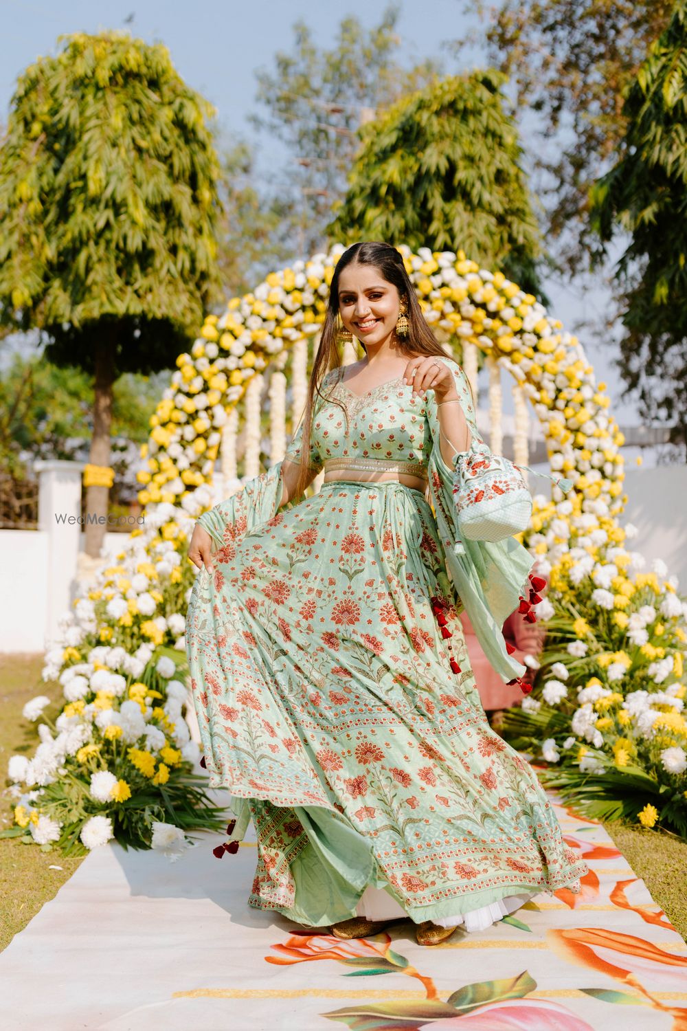 Photo of twirling bride on her mehendi day