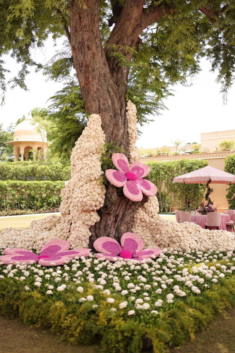 Photo of Statement floral decor on a tree with white and pink florals