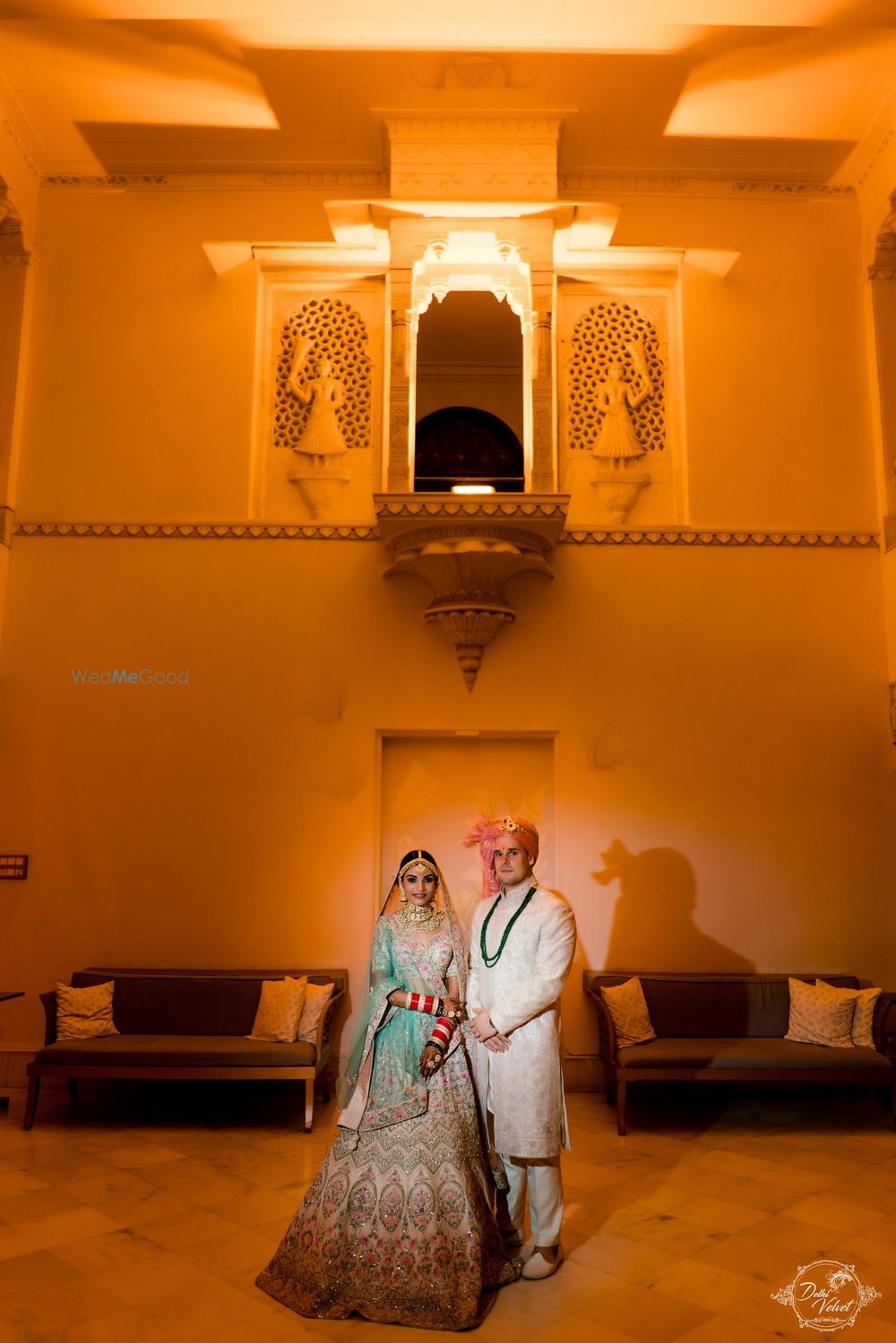 Photo of A lovely couple on their wedding dressed in beautiful outfits.