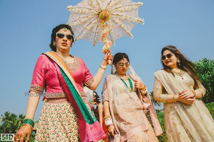 Photo of Bridal entry with a floral umbrella