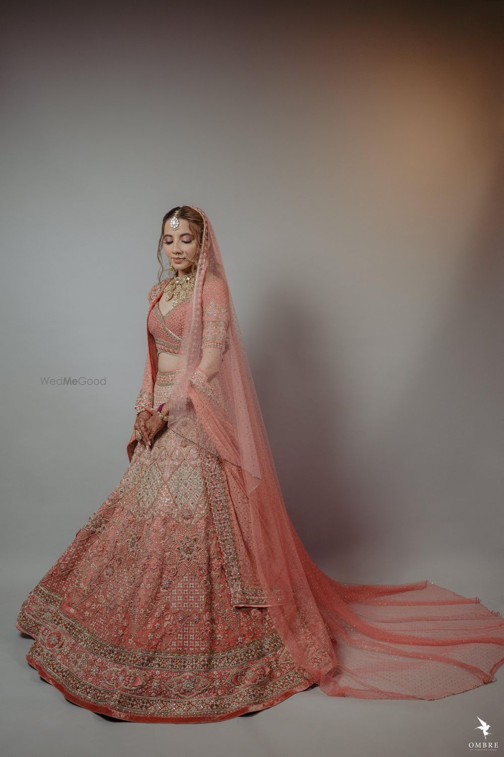 Photo of bride in a ombre peach tarun tahiliani lehenga