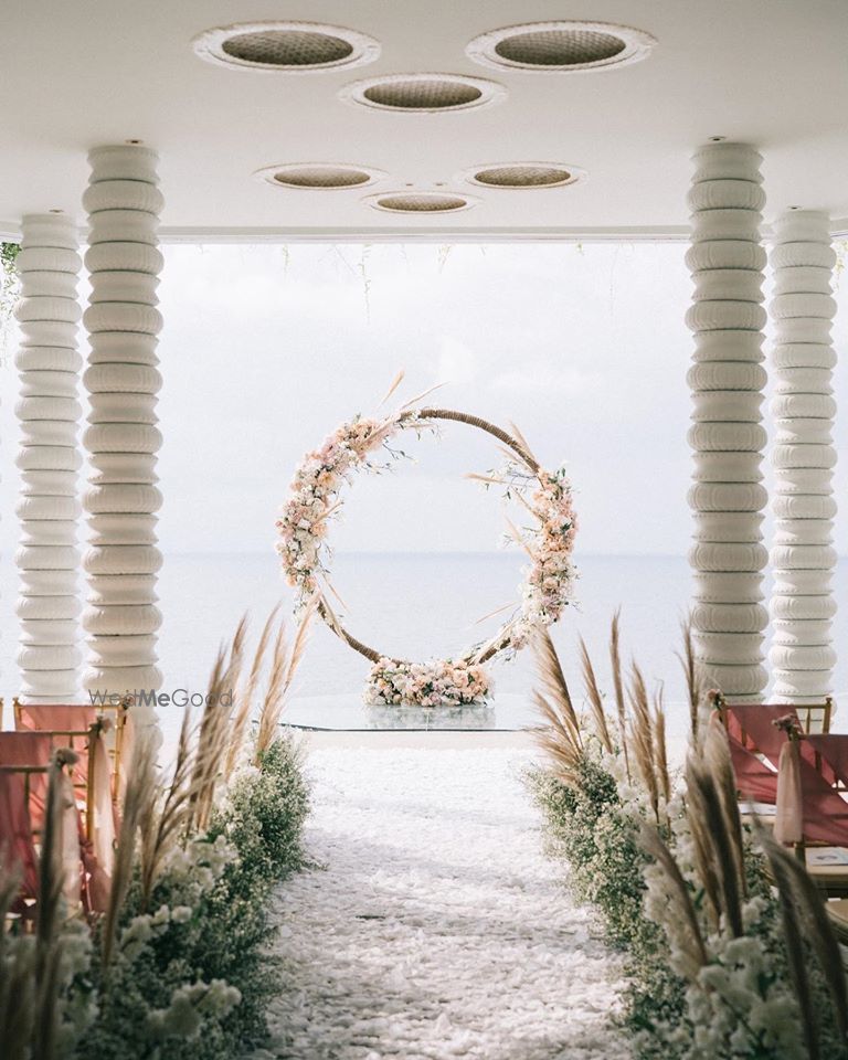 Photo of A rustic floral wreath decor for the vows.