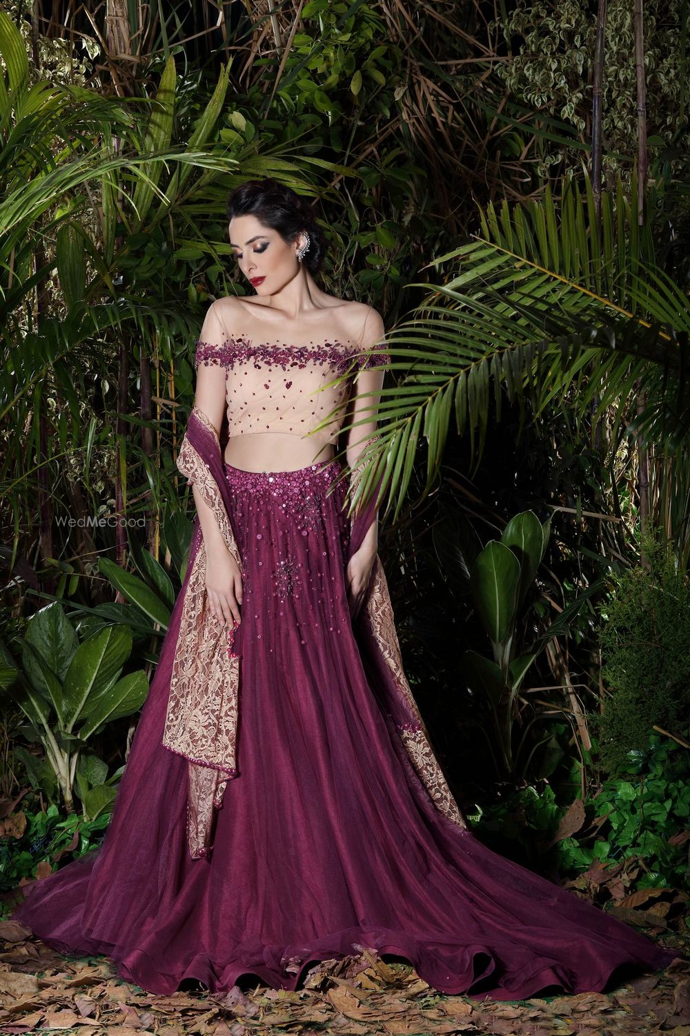 Photo of Purple lehenga with off shoulder beige blouse