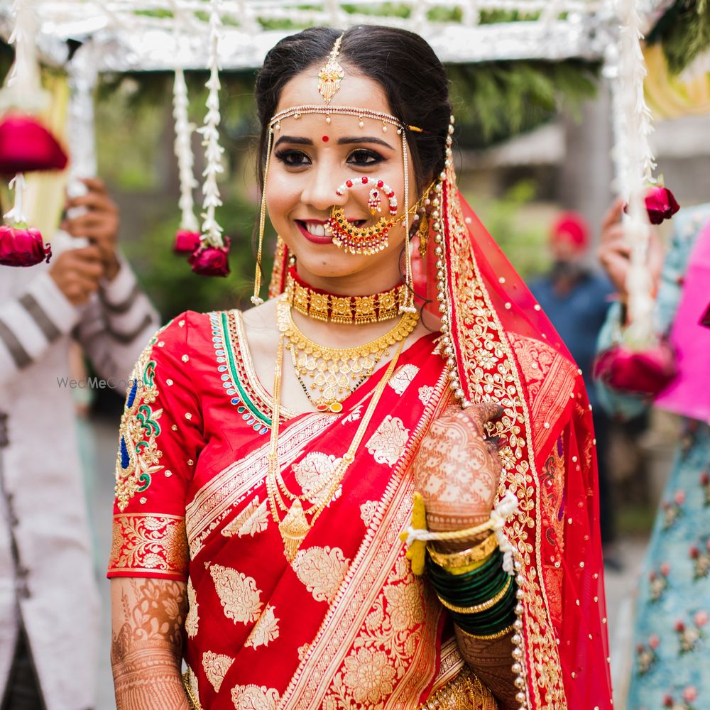 Photo of Bride in a unique over-sized nath