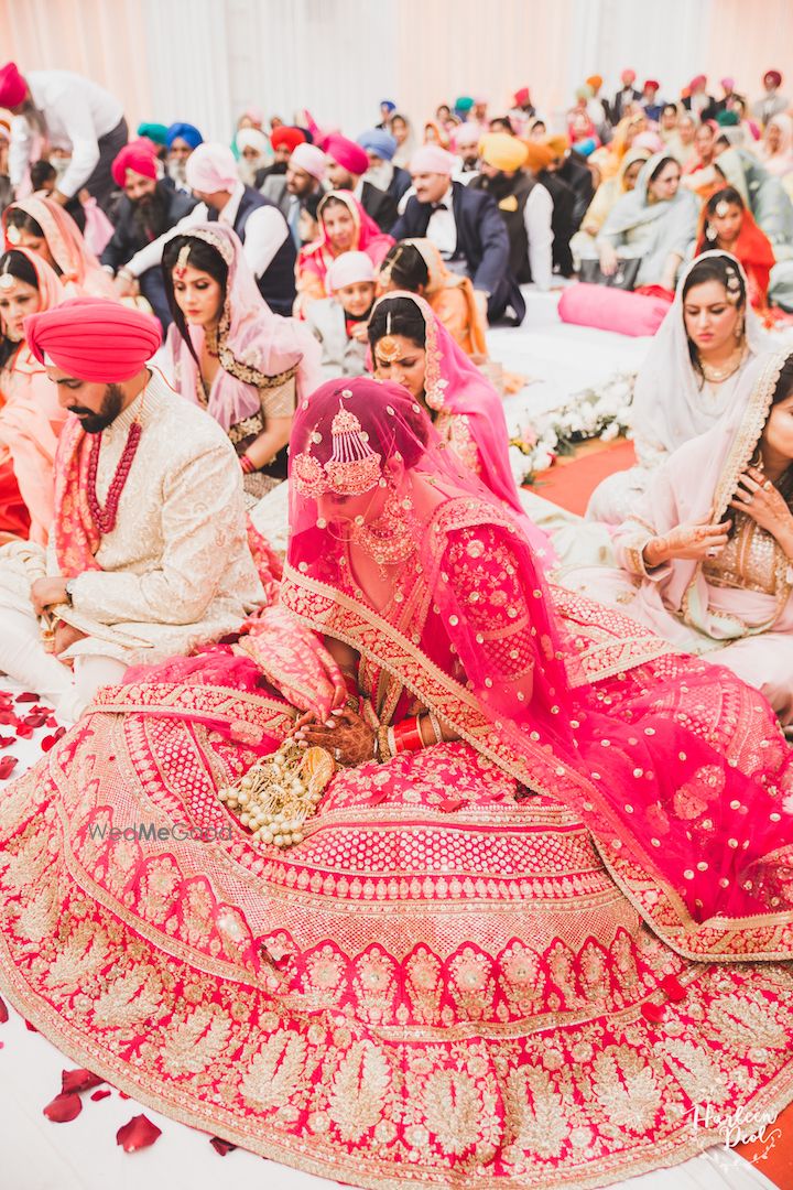 Photo of Red Sabyasachi bridal lehenga flared out