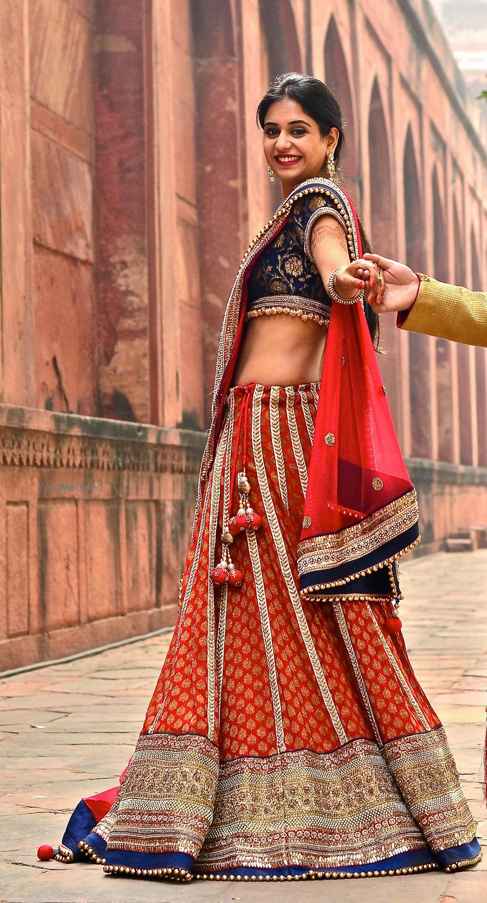 Photo of red and blue banarsi print lehenga