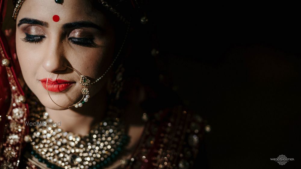 Photo of Bride with glossy lips and lids