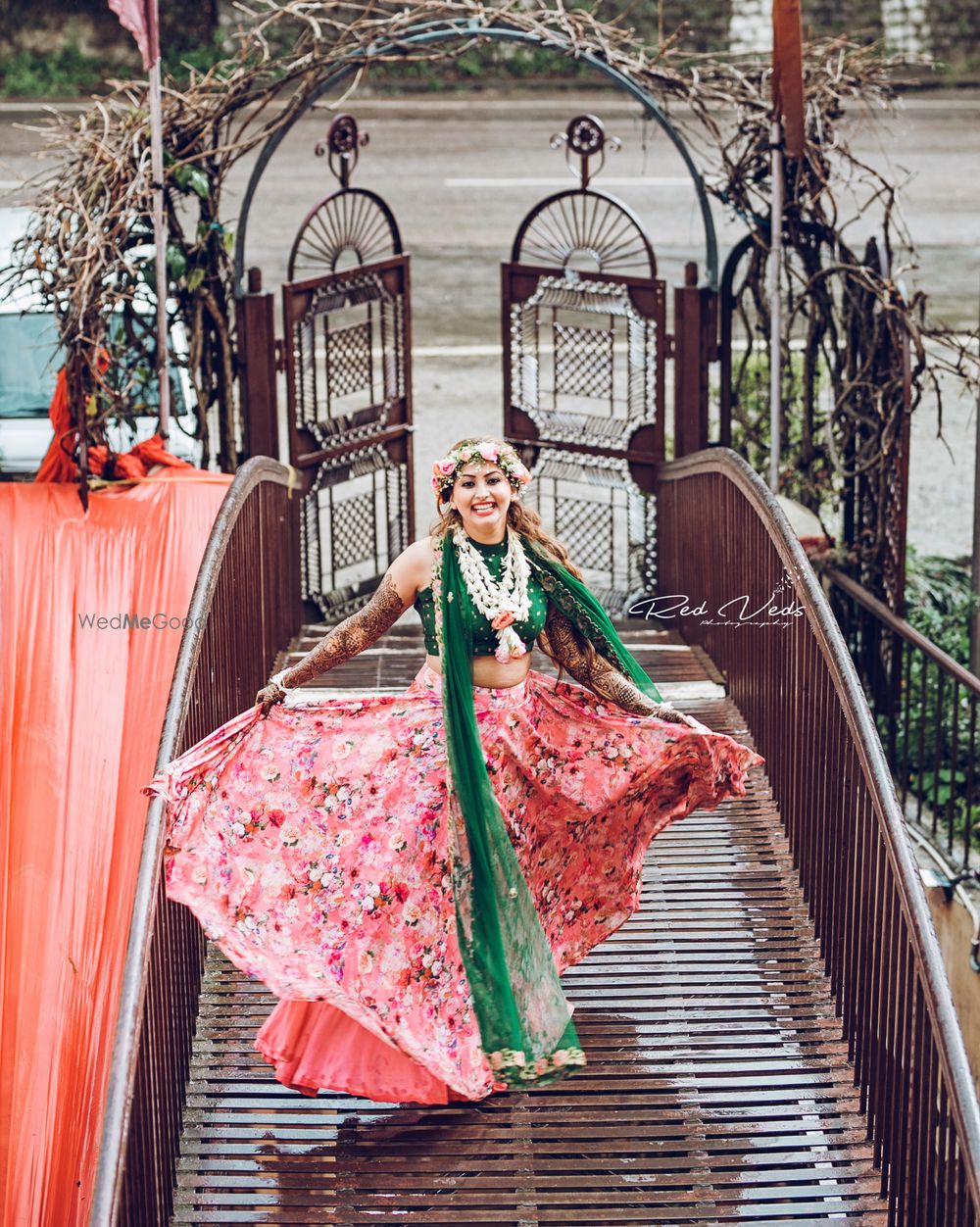 Photo of Mehendi bridal shot with floral lehenga and wreath