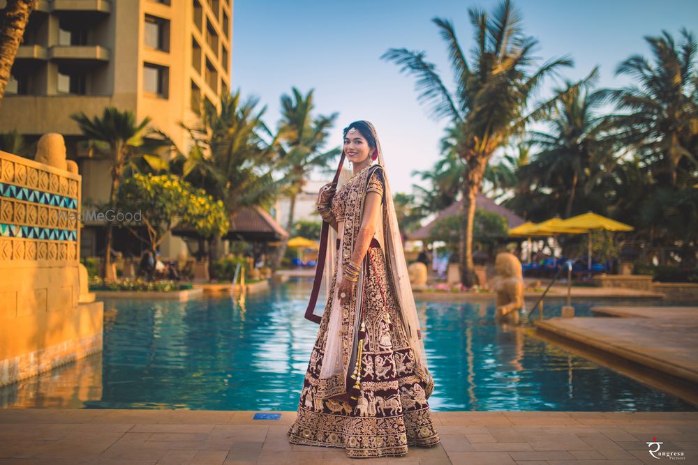 Photo of Maroon and white royal bridal lehenga