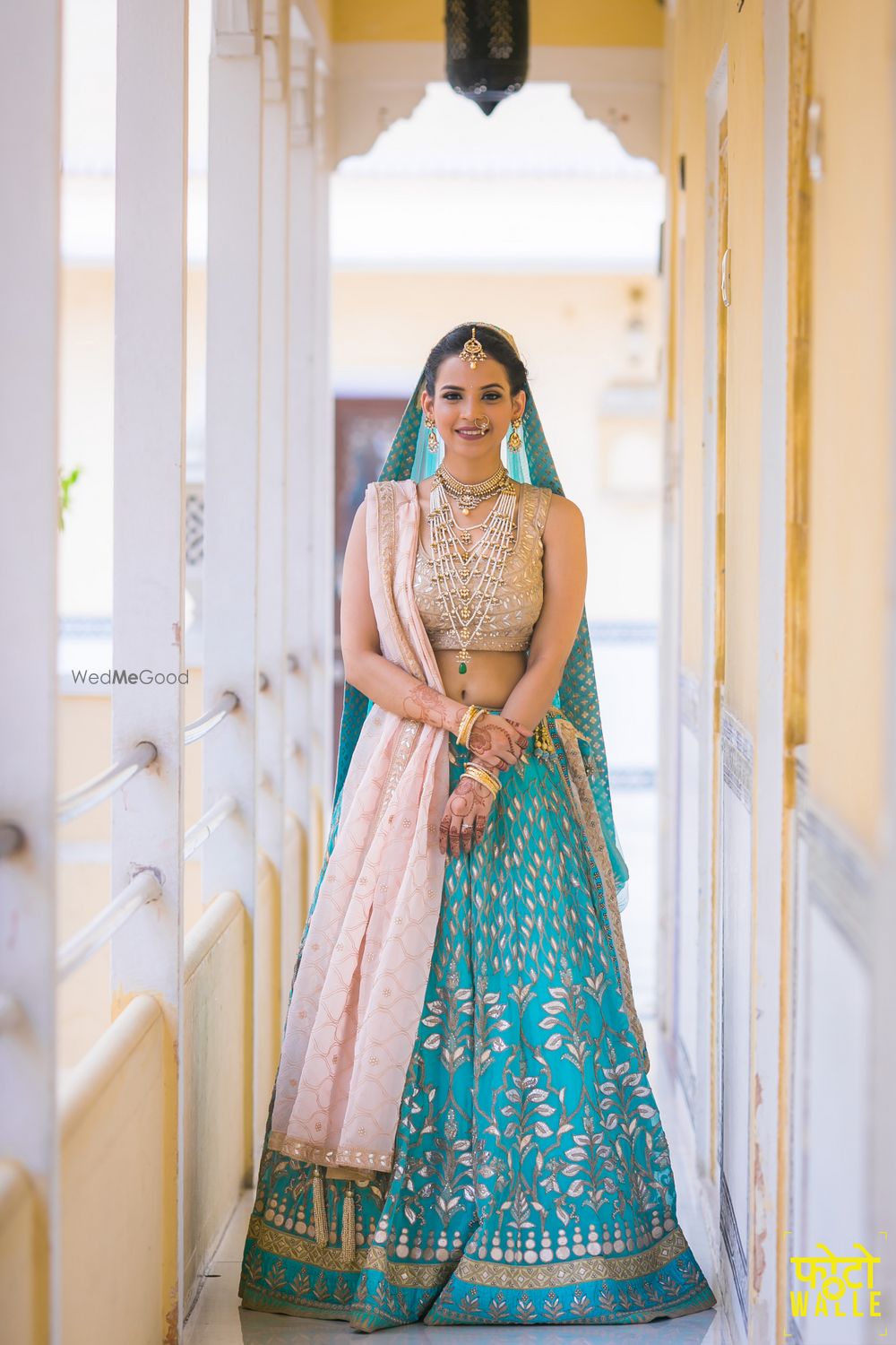 Photo of Turquoise and off white bridal lehenga