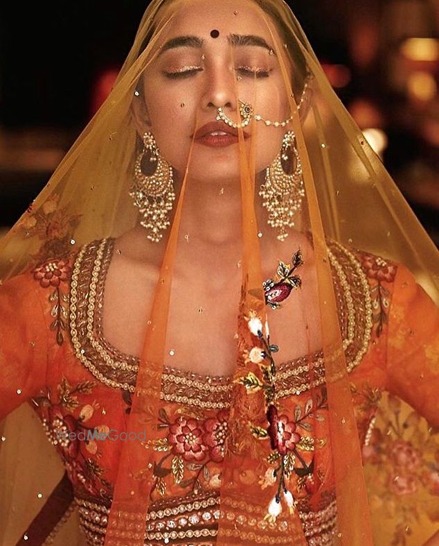 Photo of Portrait with Bride in Burnt Orange Lehenga and Veil