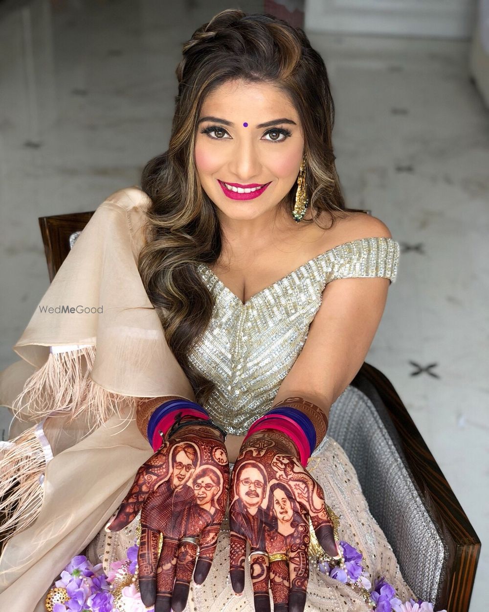 Photo of Unique bridal mehendi design with parents portraits