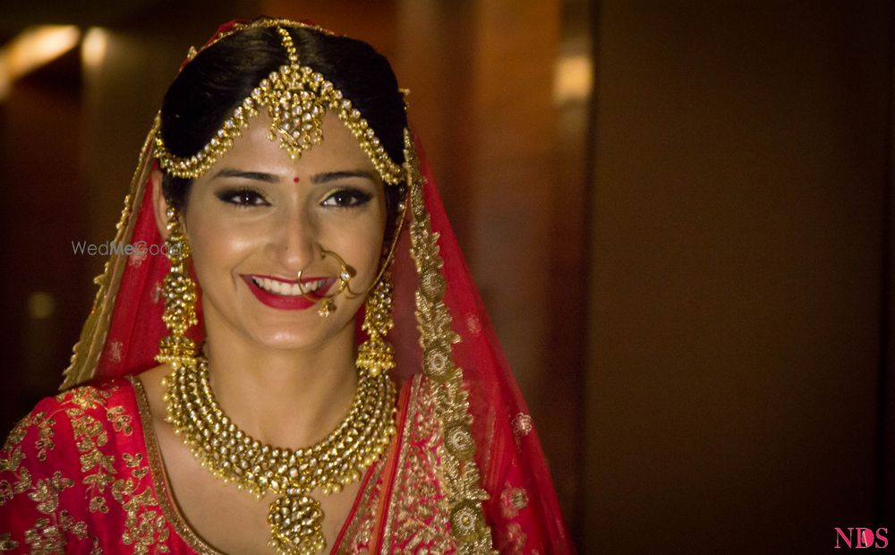 Photo of Bride in Gold Polki Jewellery with Pink Lehenga