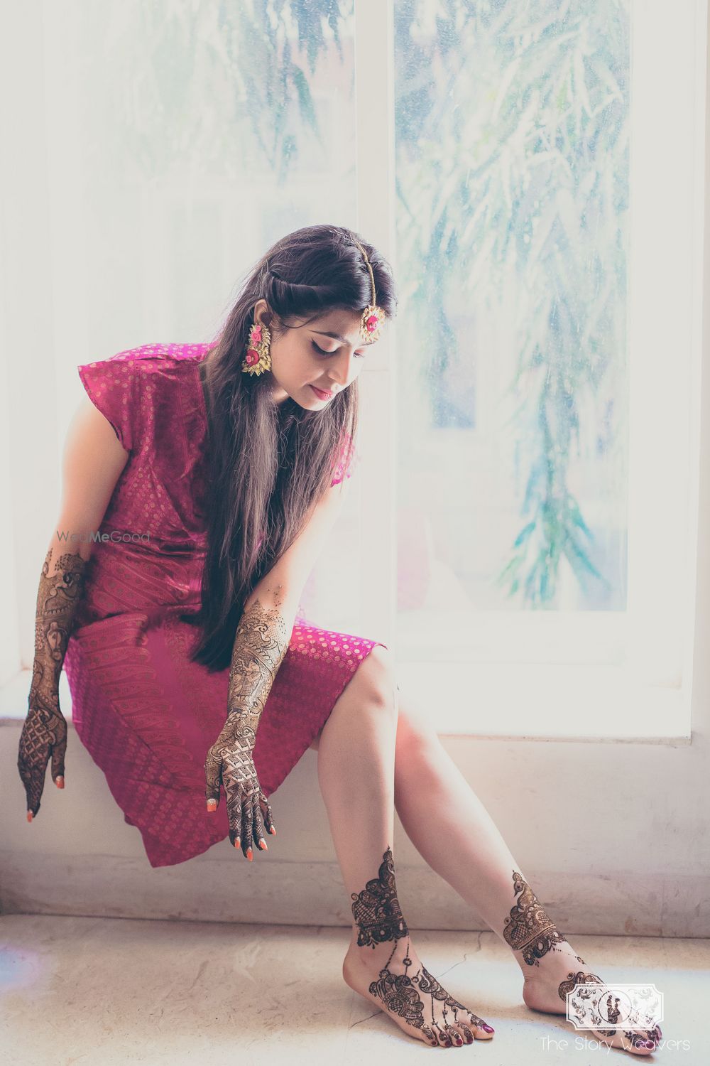 Photo of bride getting mehendi put