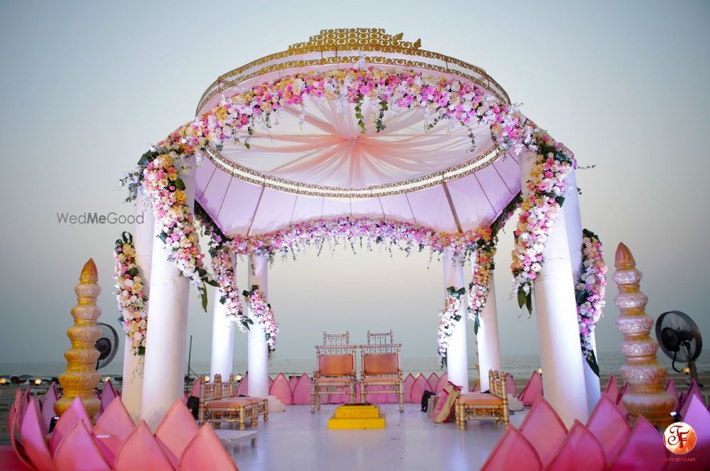 Photo of Simple white and pink mandap in open