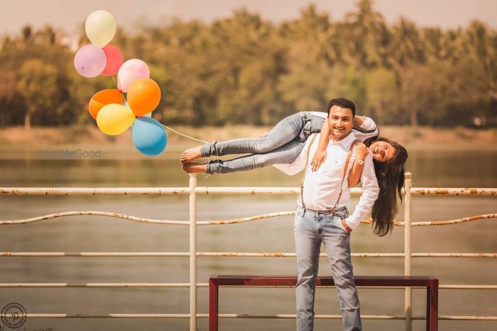 Photo of Couple Fun Pre Wedding Shoot with Balloons on Feet