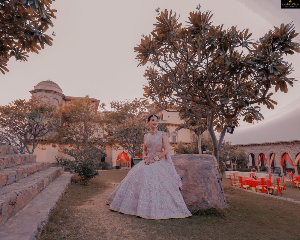 Photo of Bride wearing a pastel pink lehenga.