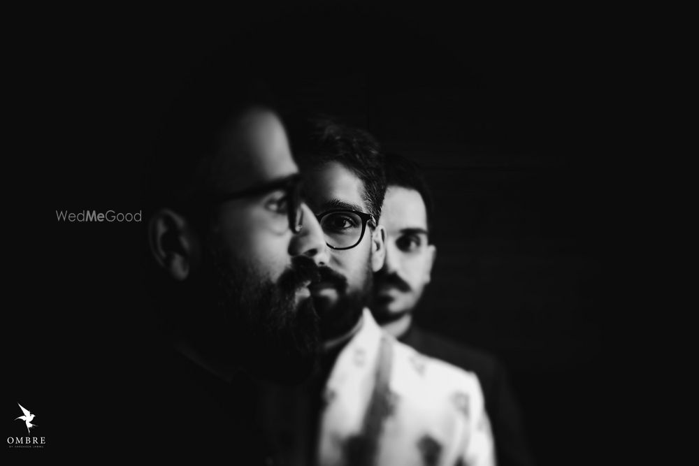 Photo of Black and white groom and groomsmen shot