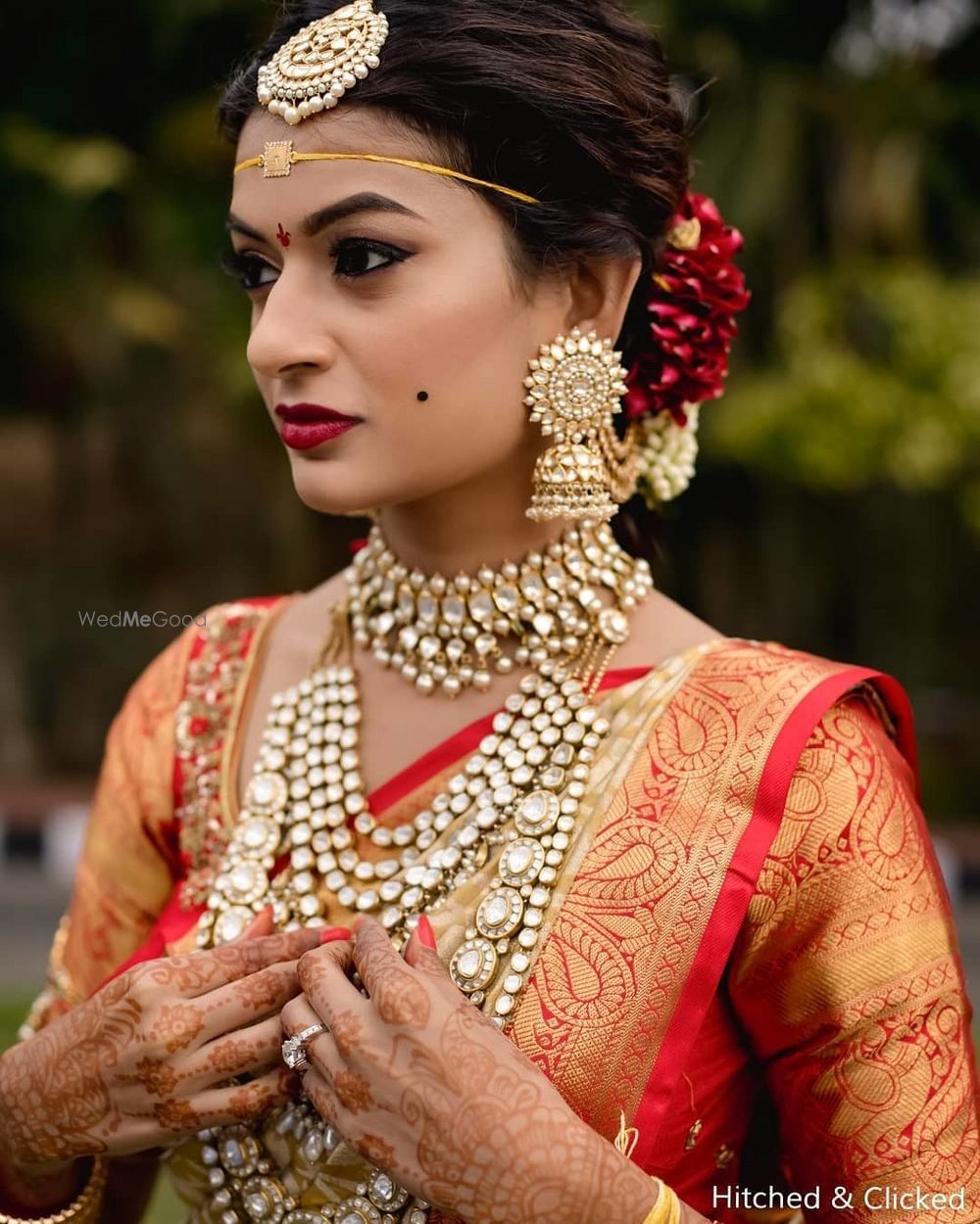 Photo of unique south indian bridal jewellery with polki and pretty earrings