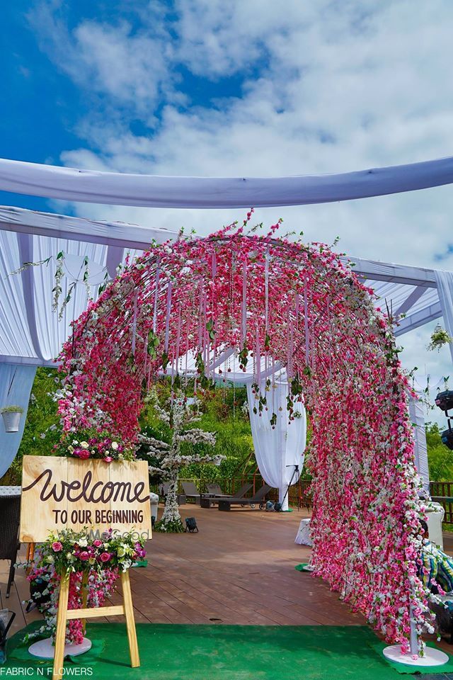 Photo of Pink entrance decor with rustic feel welcome board