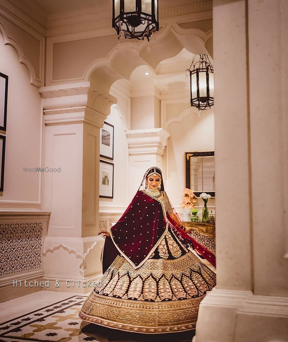 Photo of maroon and gold bridal lehenga with velvet dupatta