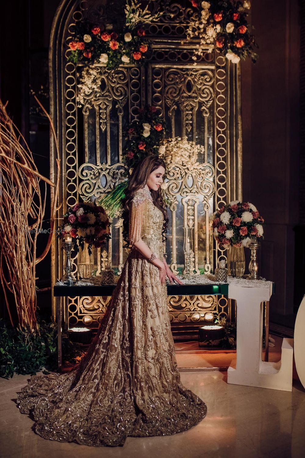 Photo of Bride dressed in a champagne gold gown.