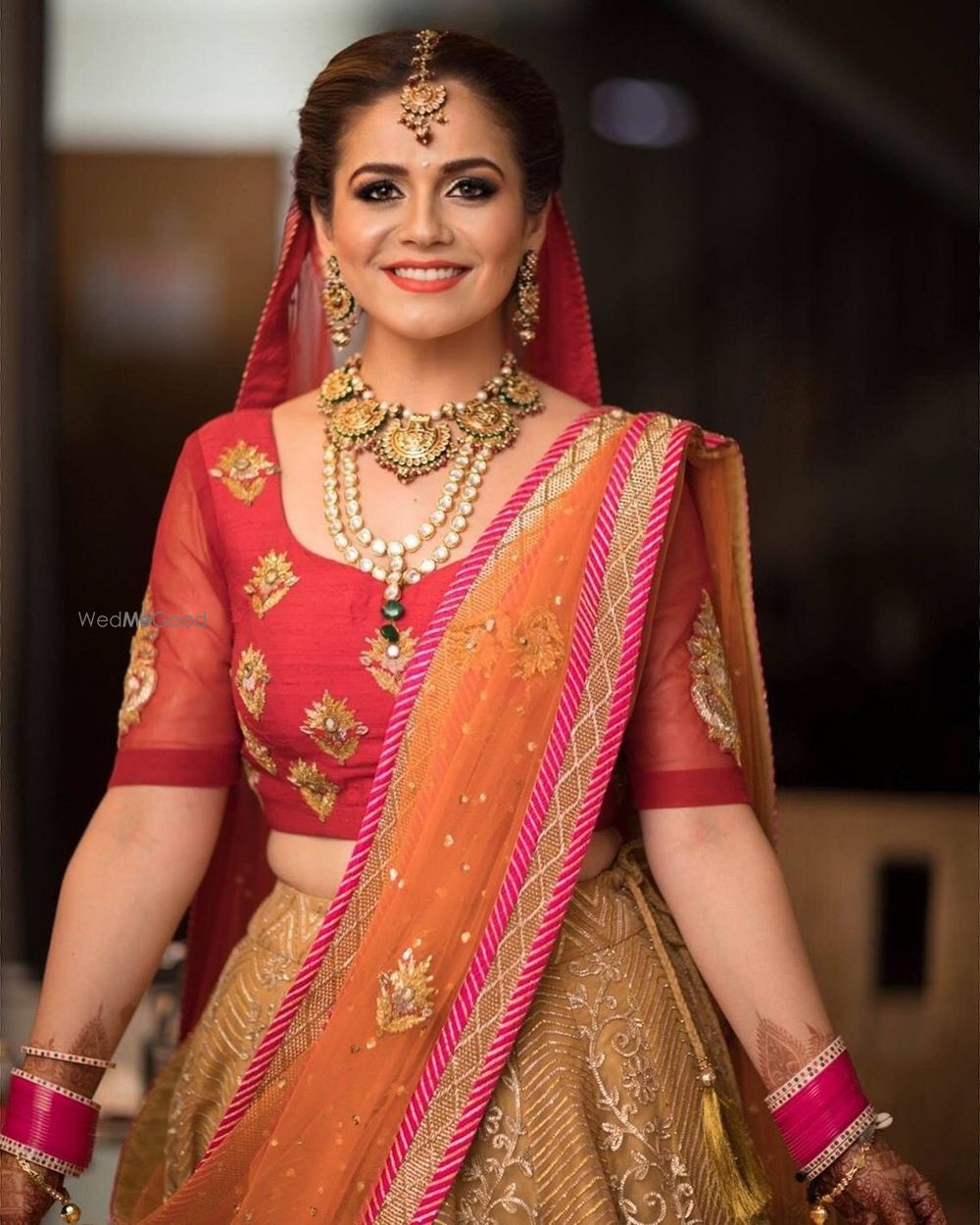 Photo of Simple bridal lehenga with orange and pink elements