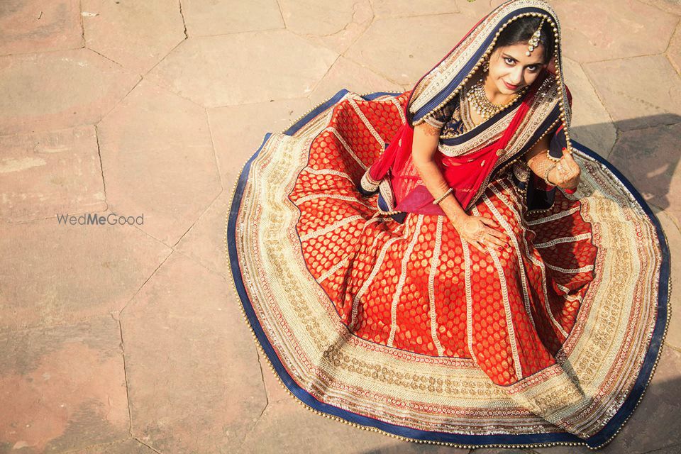 Photo of red banarsi lehenga with blue border