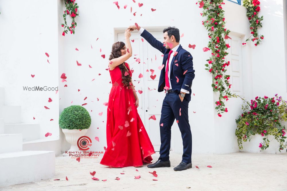 Photo of Couple Dancing Candid Shot with Red Petals