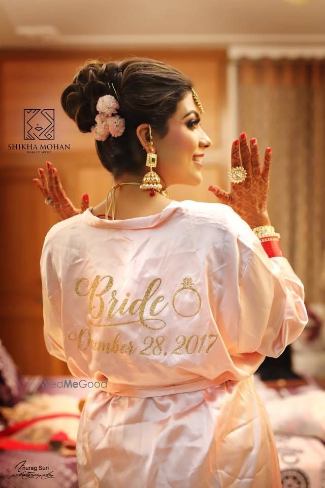 Photo of Bride getting ready shot idea with customised robe with wedding date