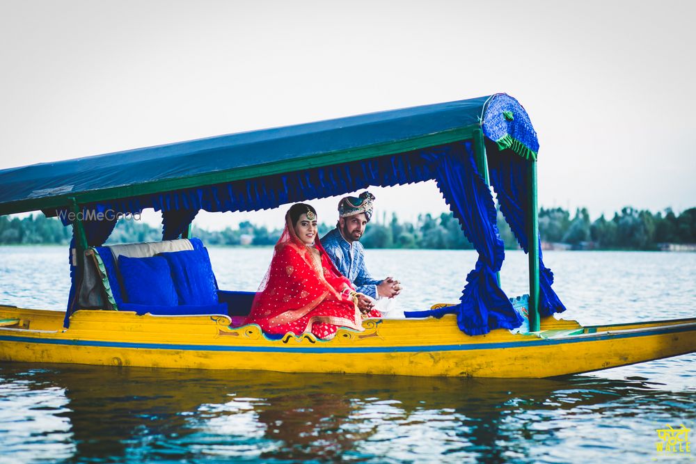 Photo of Bride and groom entering on a shikara