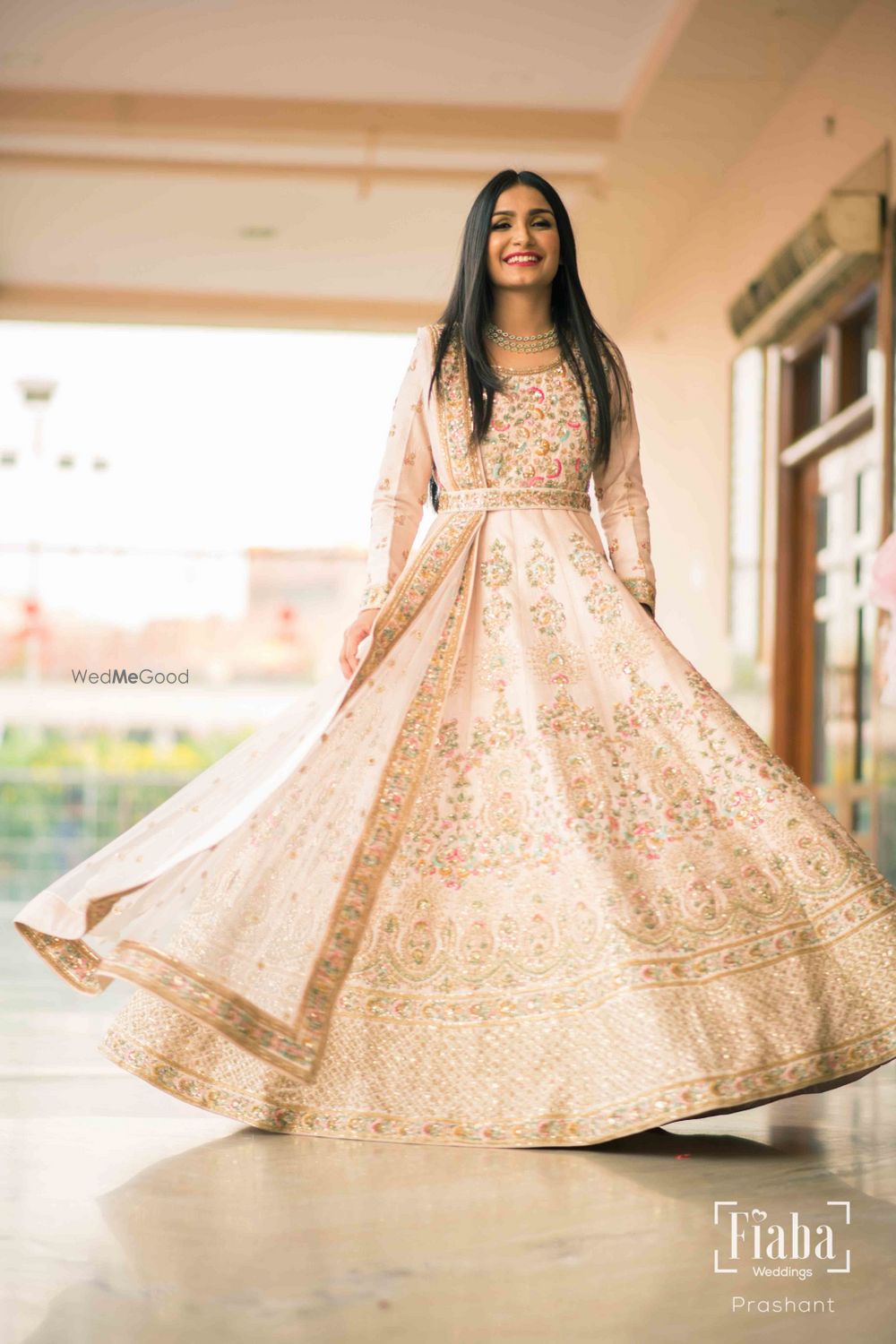 Photo of Floor length white Anarkali with belt for engagement