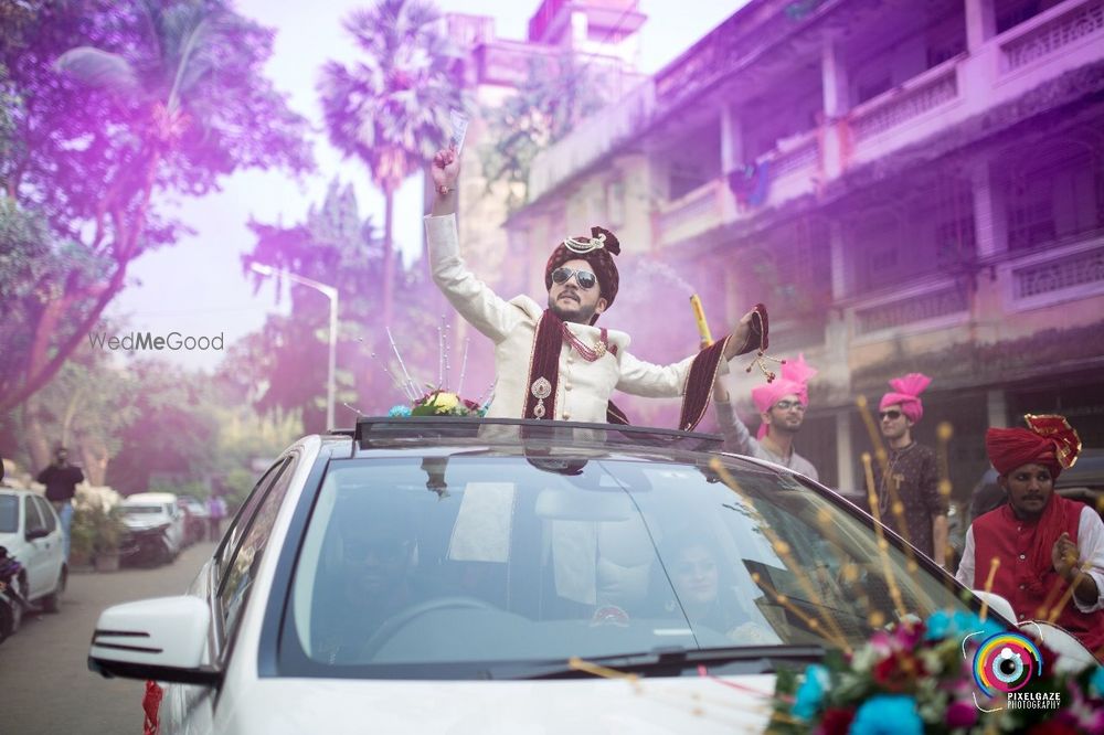 Photo of Groom looking out through sunroof entry