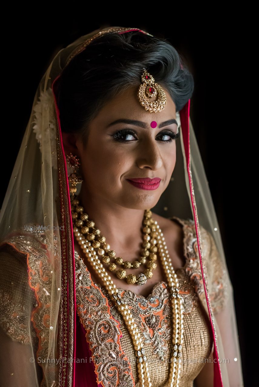 Photo of Peach and Gold Lehenga Bridal Portrait