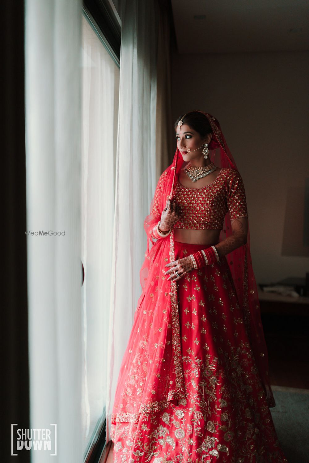 Photo of Red and gold modern bridal lehenga