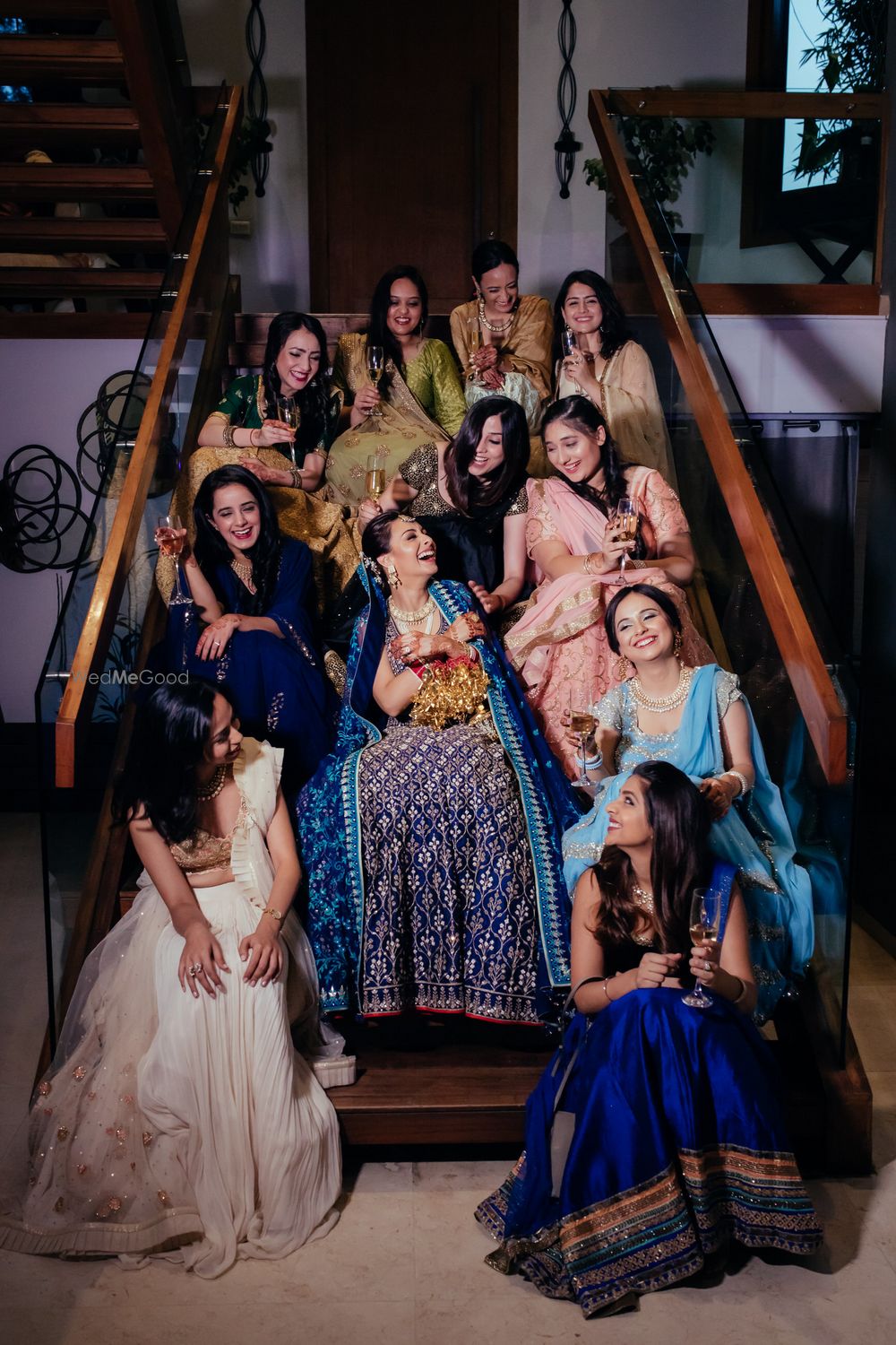 Photo of Cute bride and bridesmaid photo on the stairs