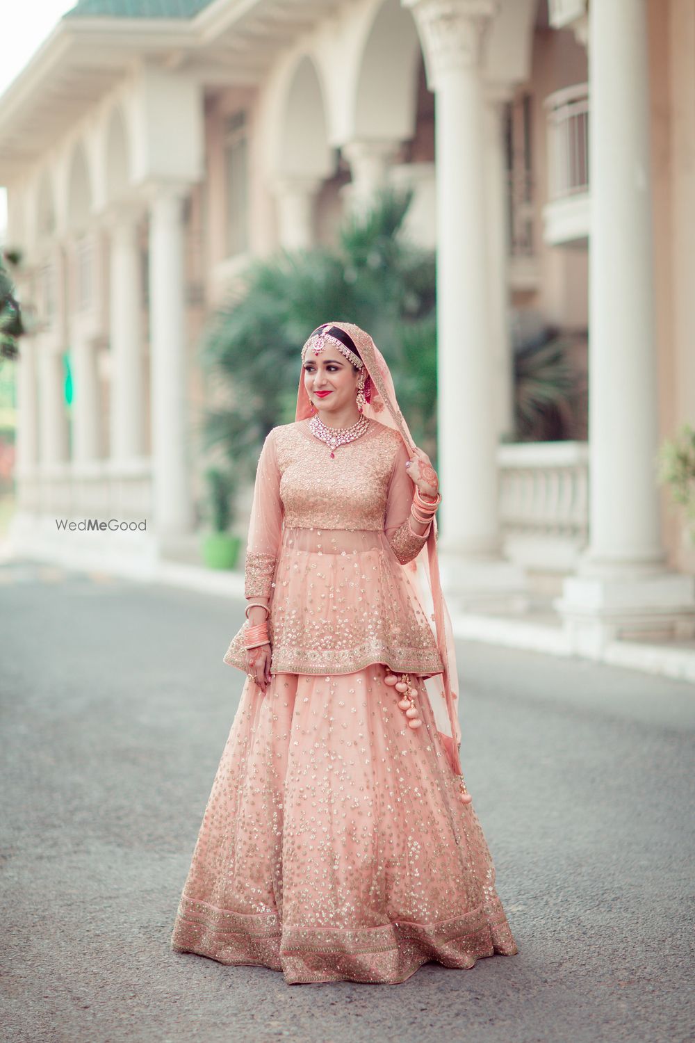 Photo of Unique peach lehenga with peplum blouse