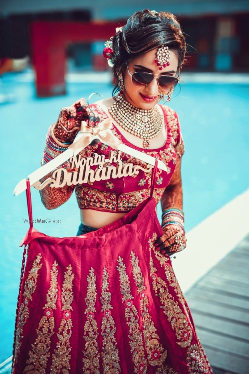 Photo of Bride with lehenga on customised bridal lehenga