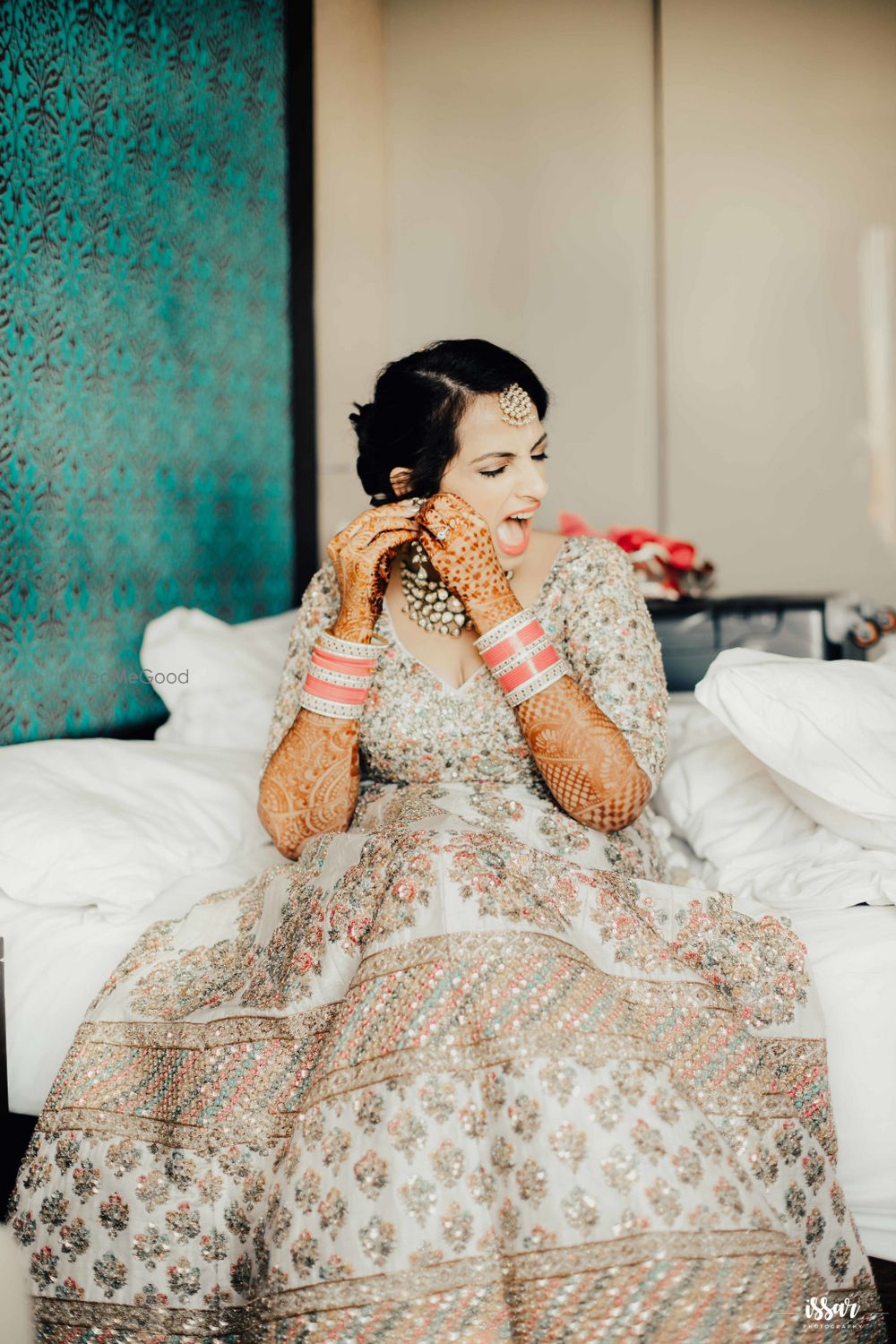 Photo of Crazy bridal portrait wearing earrings