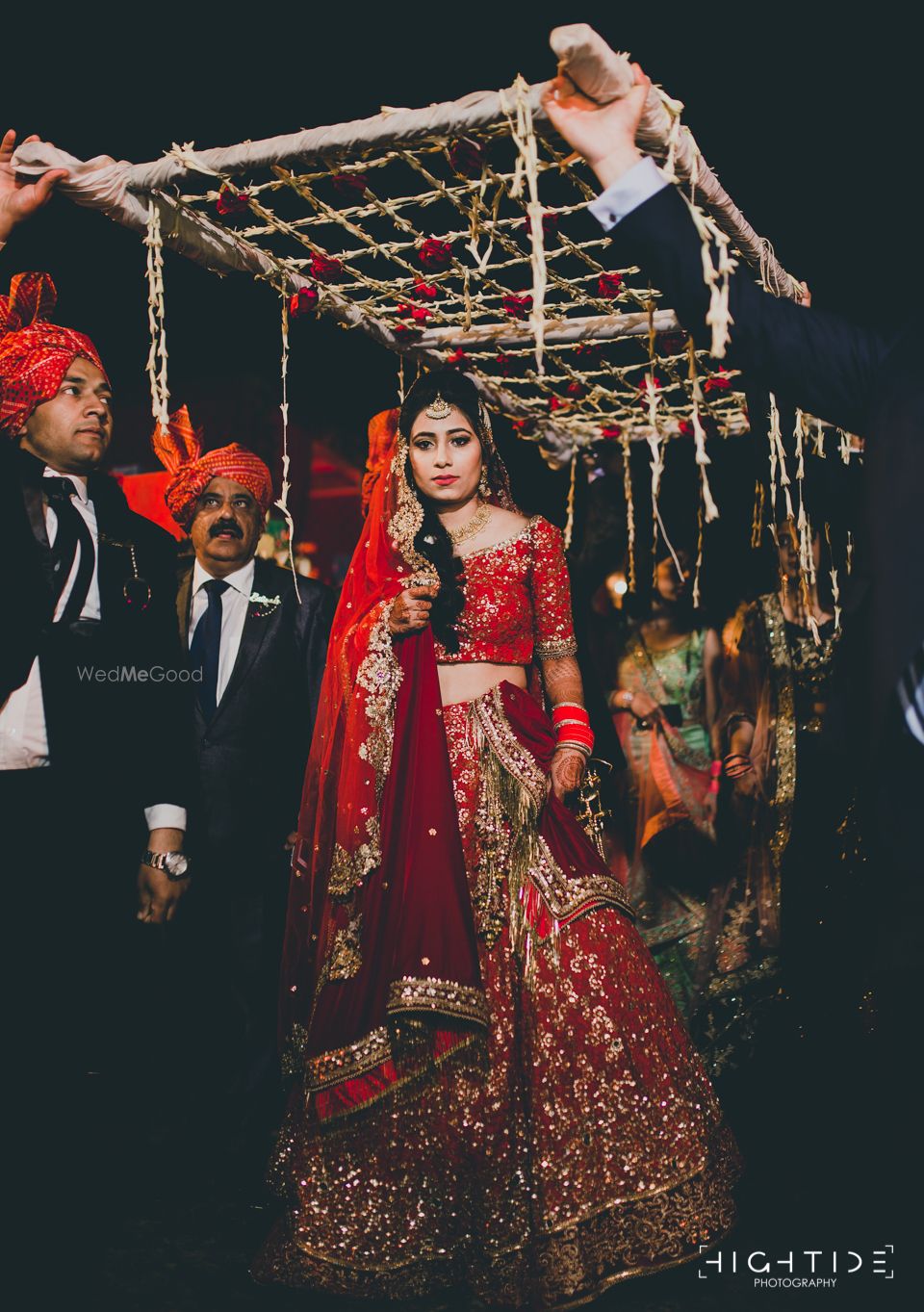 Photo of Red sequin bridal lehenga entry photo