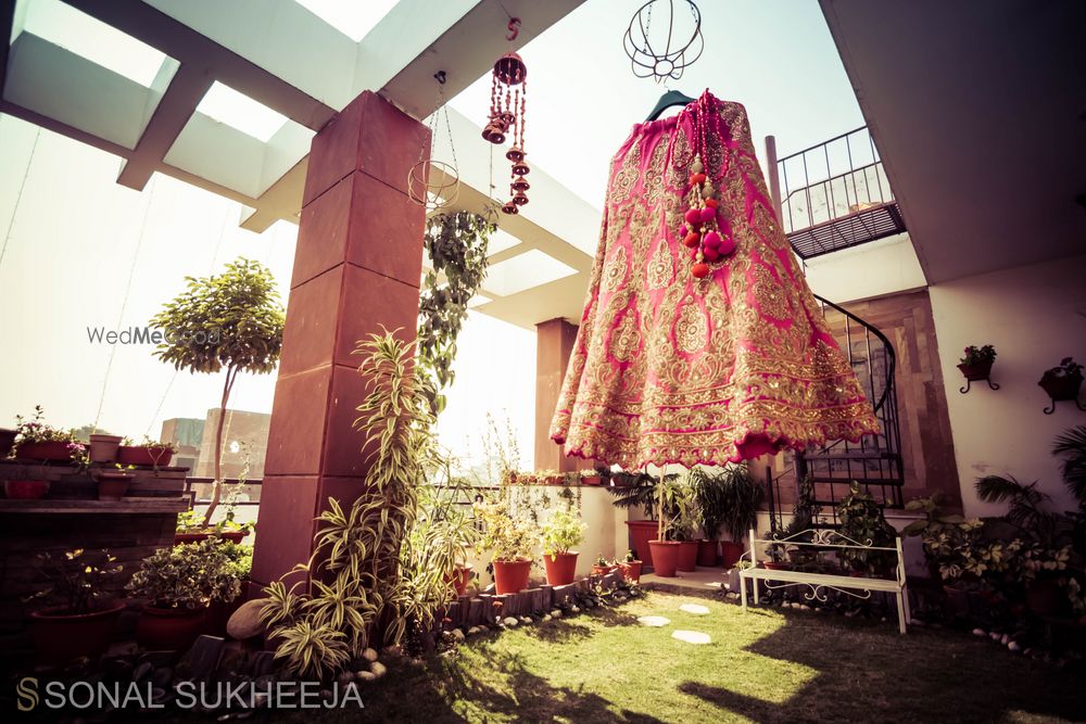 Photo of pink and gold lehenga